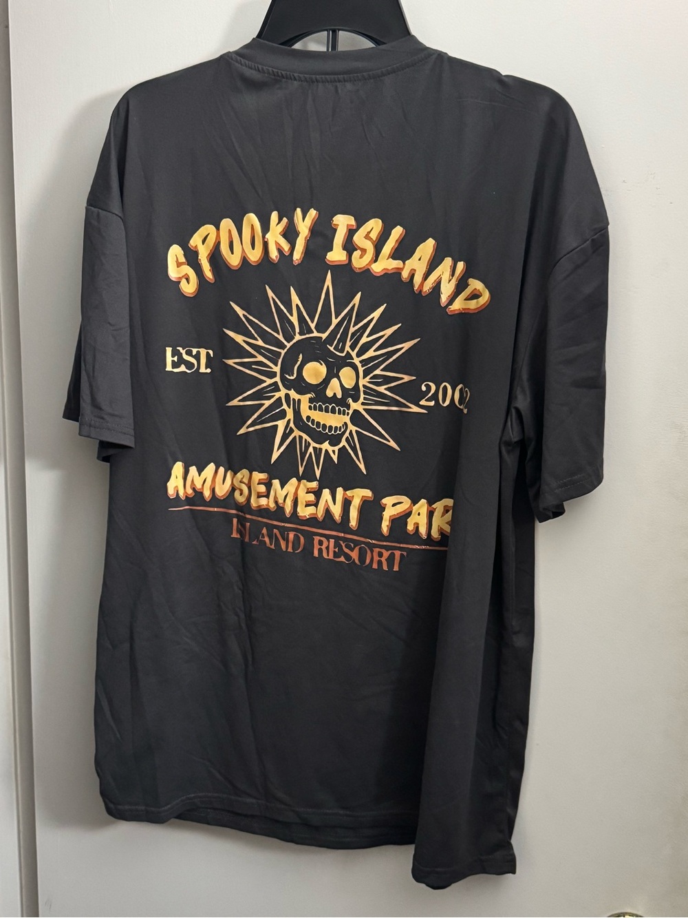 Black Tee with Gold Skull Sun Graphic